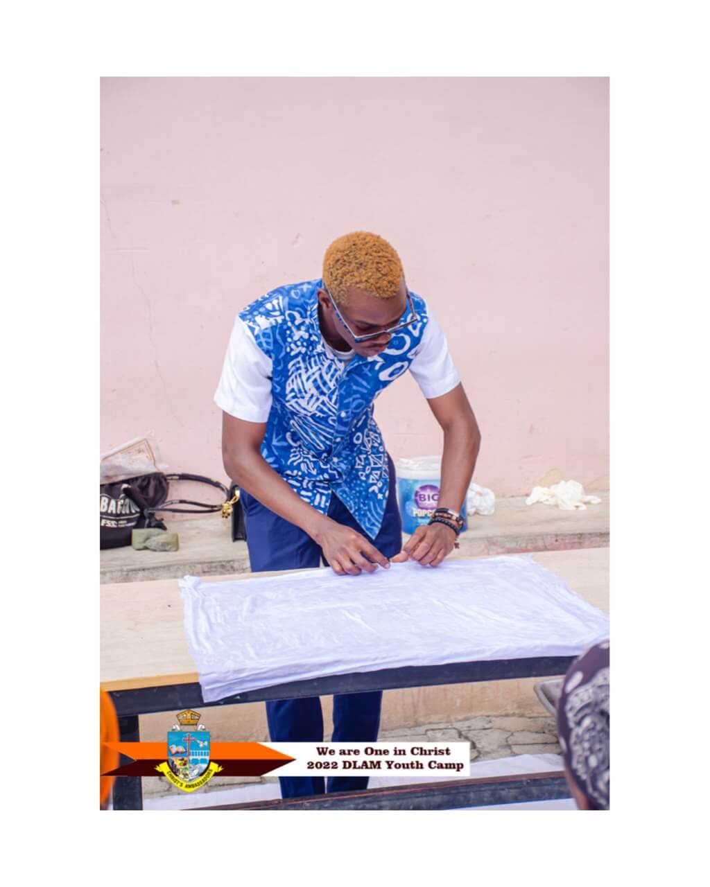 Artisan dyeing fabric in vibrant outdoor setting